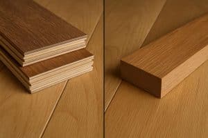 Close-up comparison of engineered hardwood and solid hardwood flooring in a modern home setting