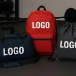 Branded custom sports bags showcasing company logos for fitness and promotional marketing