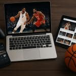 Streaming NBA game on laptop with live stats and social media chat for modern fans